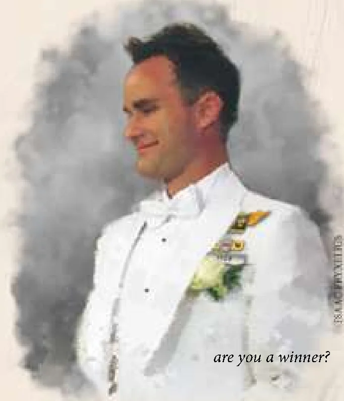 Winner in tuxedo holding trophy